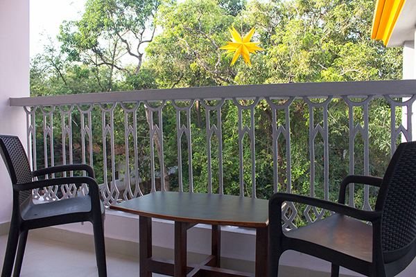 Balcony area attached to each room at Anjuna Plaza, Guest House, Anjuna, Goa